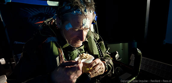 Solar Impulse 2 pilot André Borschberg enjoying a Nestlé meal during flight
